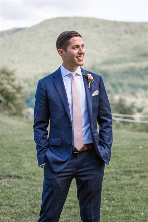 blue suit and pink tie